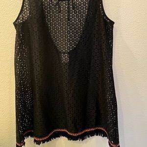 Patterned mesh sleeveless tan top with embroidered edge.